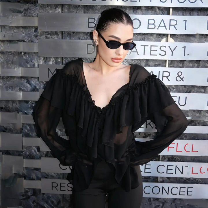 Blouse for women with voluminous ruffle details and an elegant button placket Lune London