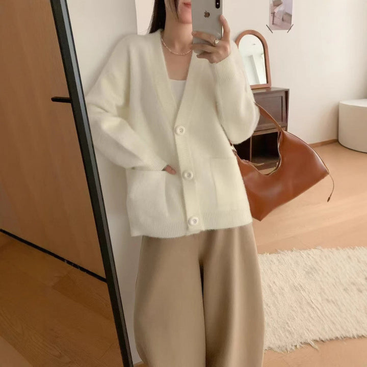Cardigan pelucheux à boutons pour femmes avec poches élégantes Chic & Stil