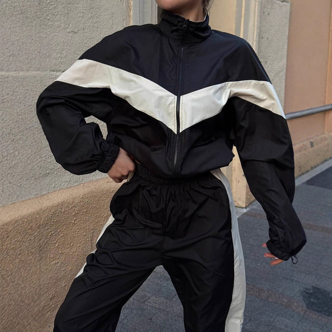Women's sporty windbreaker with high collar and contrasting stripes Chic & Stil