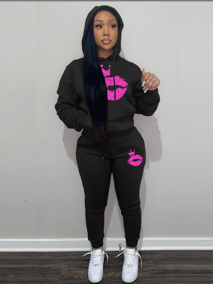 Women's hoodie and jogger set with a catchy lip pattern and a Lune London crown