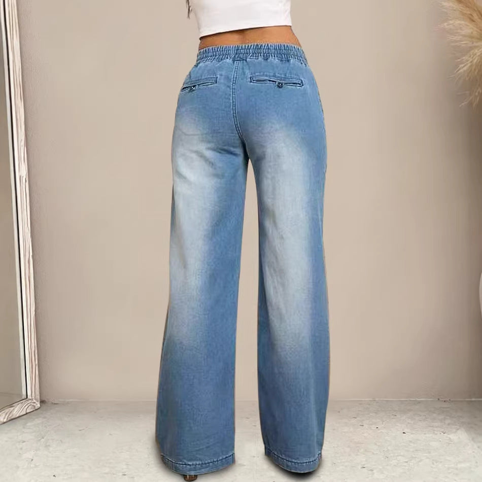 Women's wide-cut jeans with elastic waistband and trendy used look