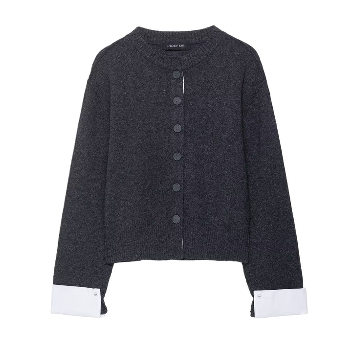 Trendy women's knitted jacket with contrasting sleeves and a continuous button placket Lune London