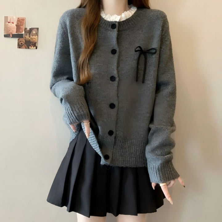 Ladies comfortable cardigan with decorative buttons and chic knot accents