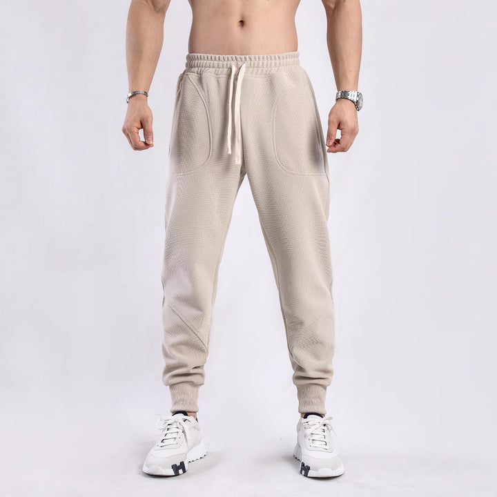 Men's sporty jogger pants with breathable inserts and elastic waistband Lune London