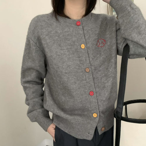 Ladies cozy knitted pullover with buttoned neckline and embroidered pattern Lune London