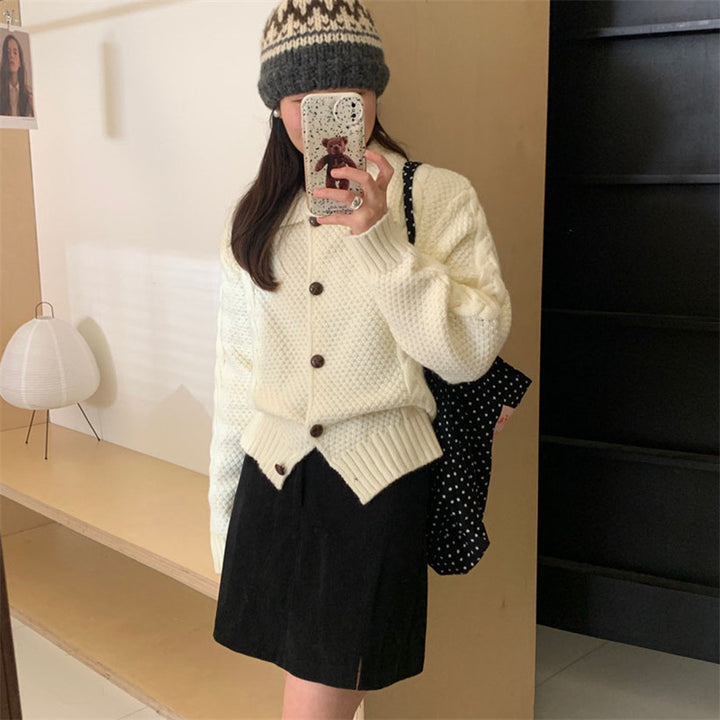 Women thick knit cardigan with contrasting buttons and a textured design Lune London