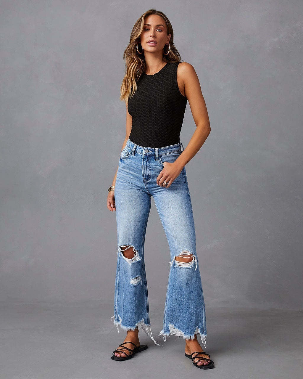 Women's Flared Jeans with Stylish Ripped Details and Frayed Hems Lune London