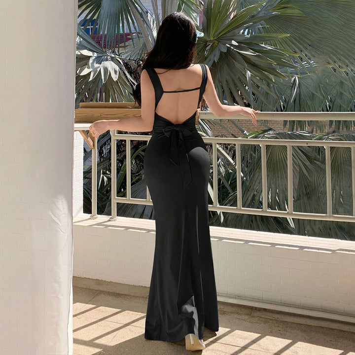 Elegant evening dress for women with refined back cutouts and decorative tie belt Chic & Stil