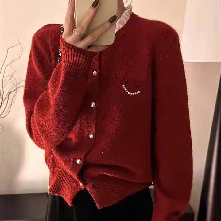 Women’s knitted jacket with decorative buttons and festive design Lune London