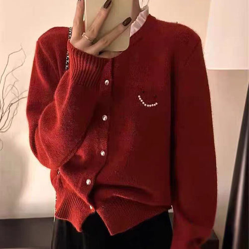 Women’s knitted jacket with decorative buttons and festive design Lune London