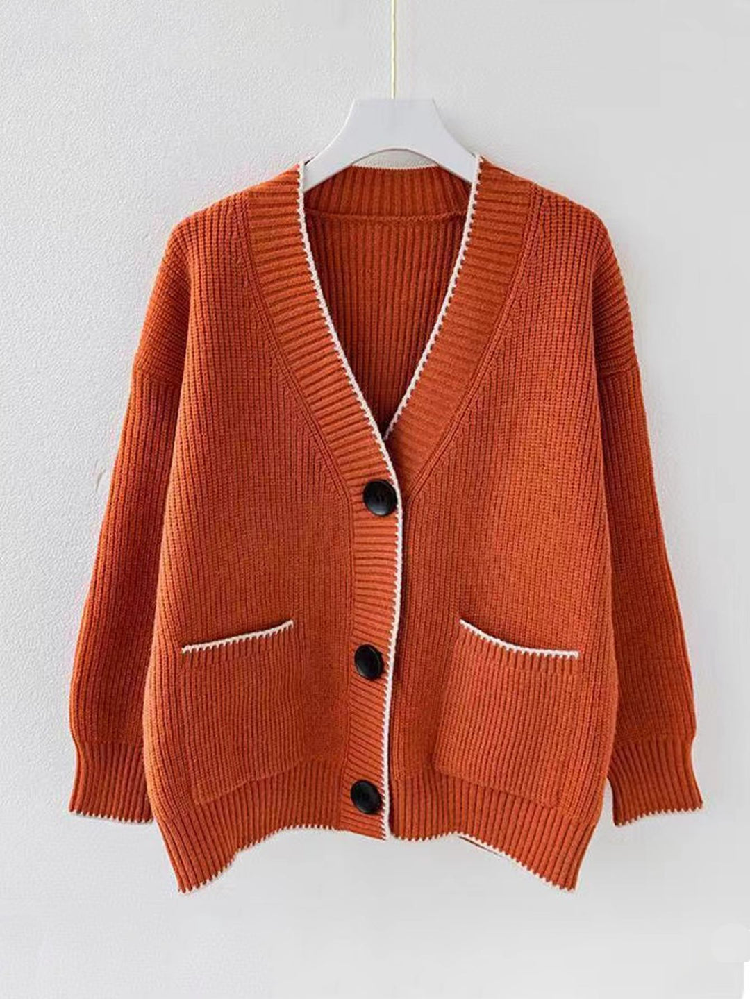Ladies thick knit cardigan with deep V-neck and practical pockets Lune London