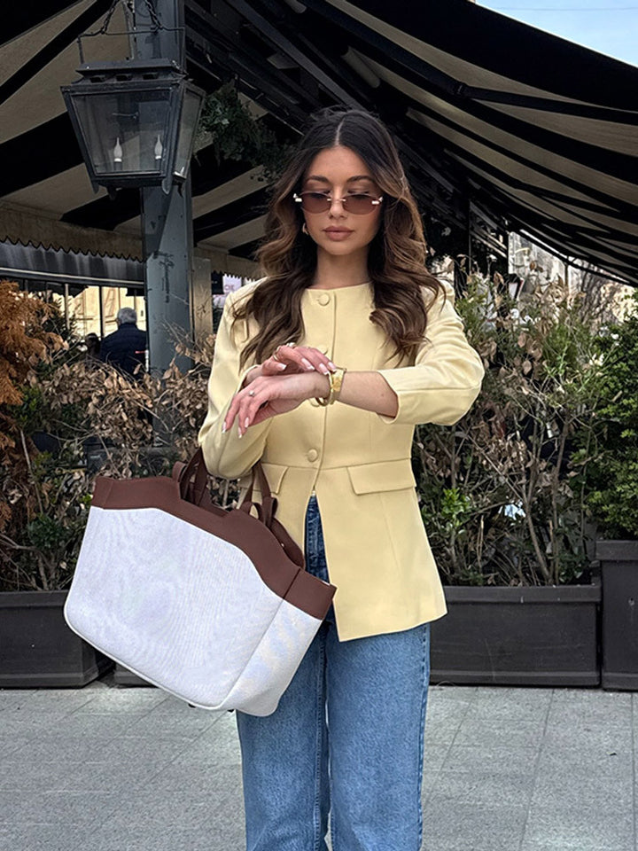 Elegant blazer jacket for women with a modern cut and a nice button detail Lune London