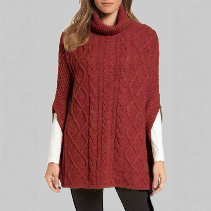 Knitted poncho for women with high collar and classic cable knit pattern Lune London
