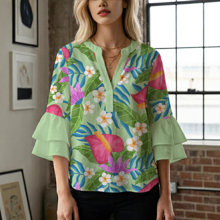 Women’s blouse with voluminous ruffled sleeves and floral pattern Lune London