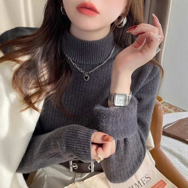 Pull femme avec col roulé et ourlet moelleux luxueux Chic & Stil