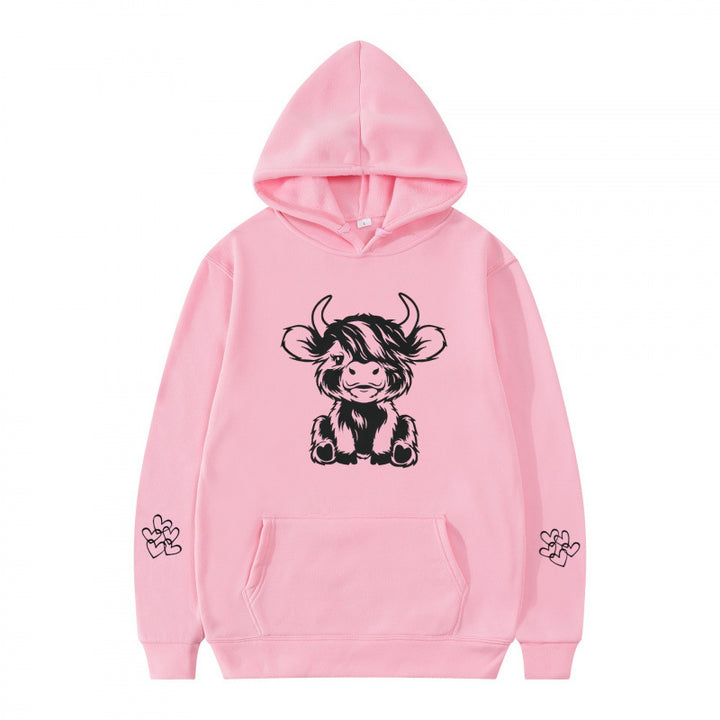 Women's hooded sweatshirt with charming cow motif and practical kangaroo pockets Lune London