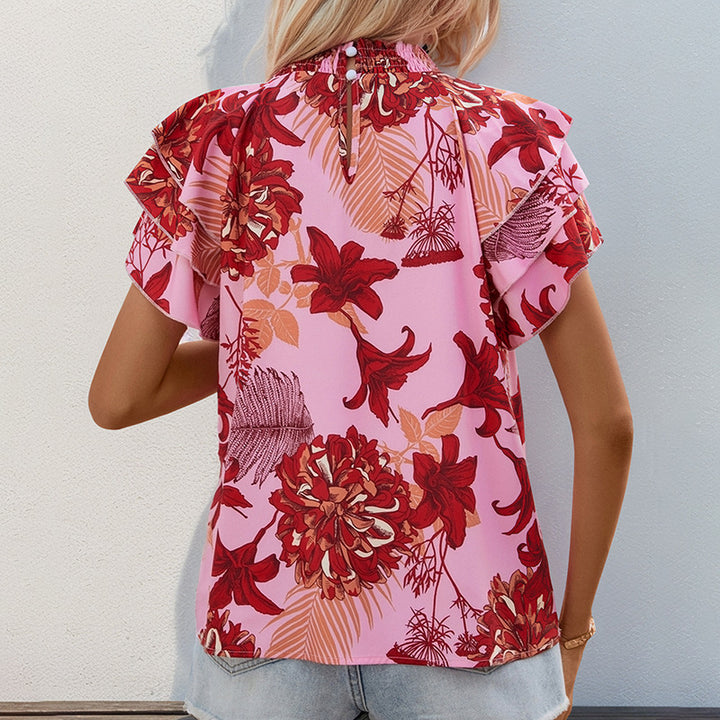 Top féminin avec des détails de volants ludiques et un motif floral Chic & Stil
