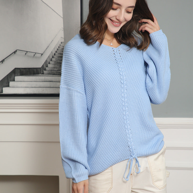 Women's thick knit sweater with an attractive V-neckline and practical drawstring details Lune London