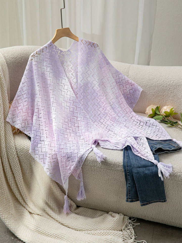 Airy knitted poncho for ladies with decorative fringes Lune London