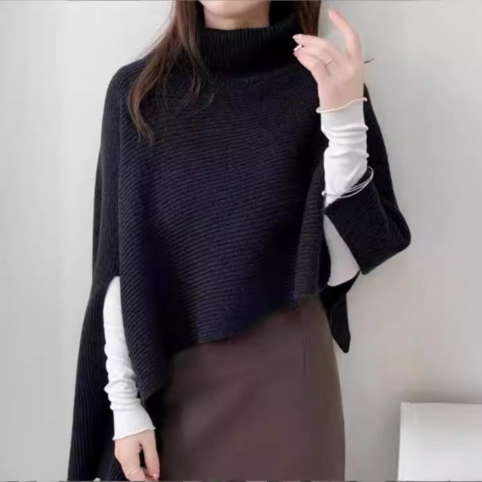 Ladies knitted poncho with high collar and asymmetrical cut Lune London