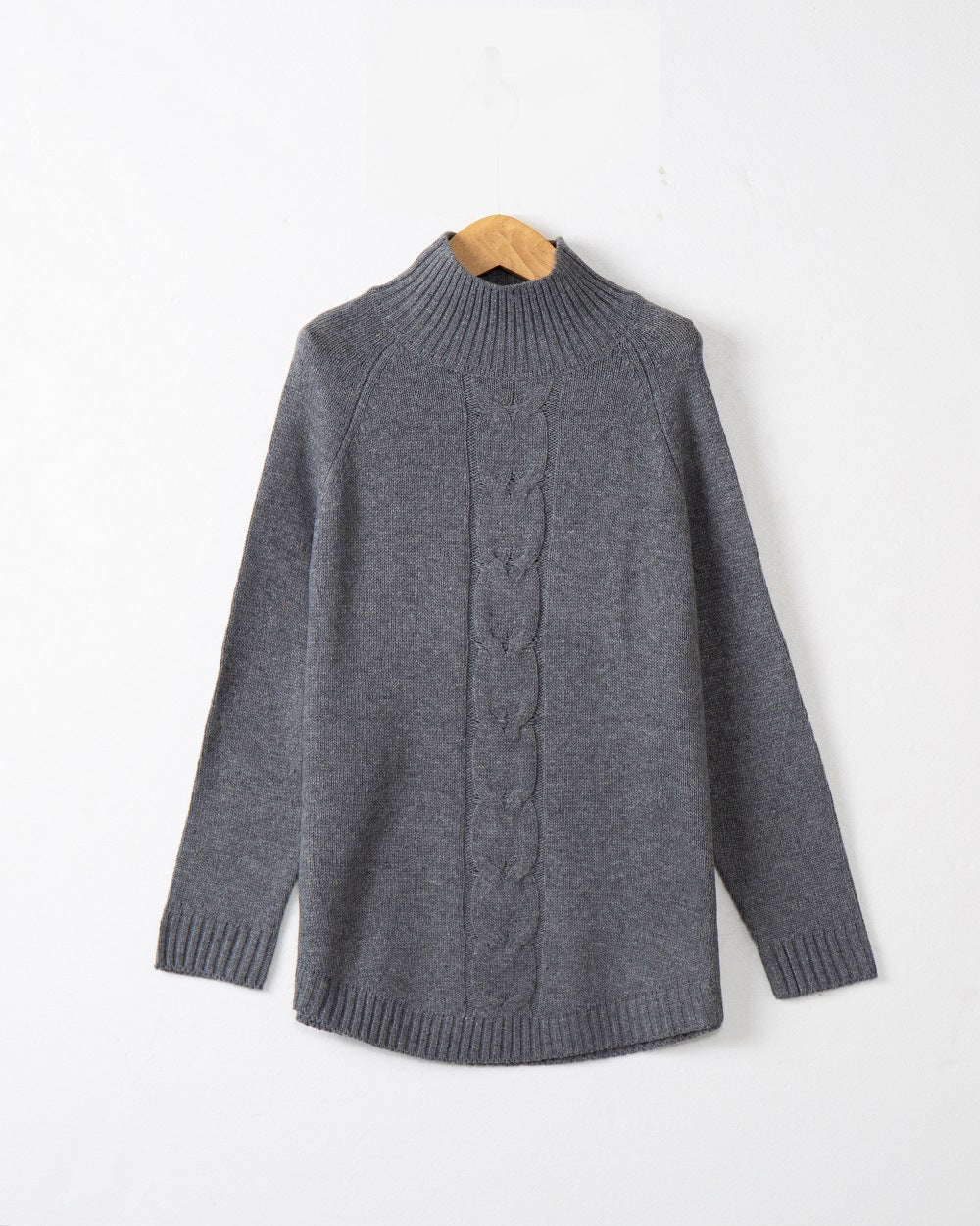 Chunky knit sweater for women with a high collar and cable patterns Lune London