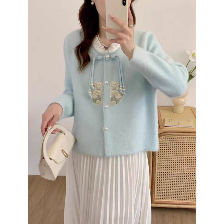 Luxurious knit sweater for women with decorative button details and ruffles Lune London