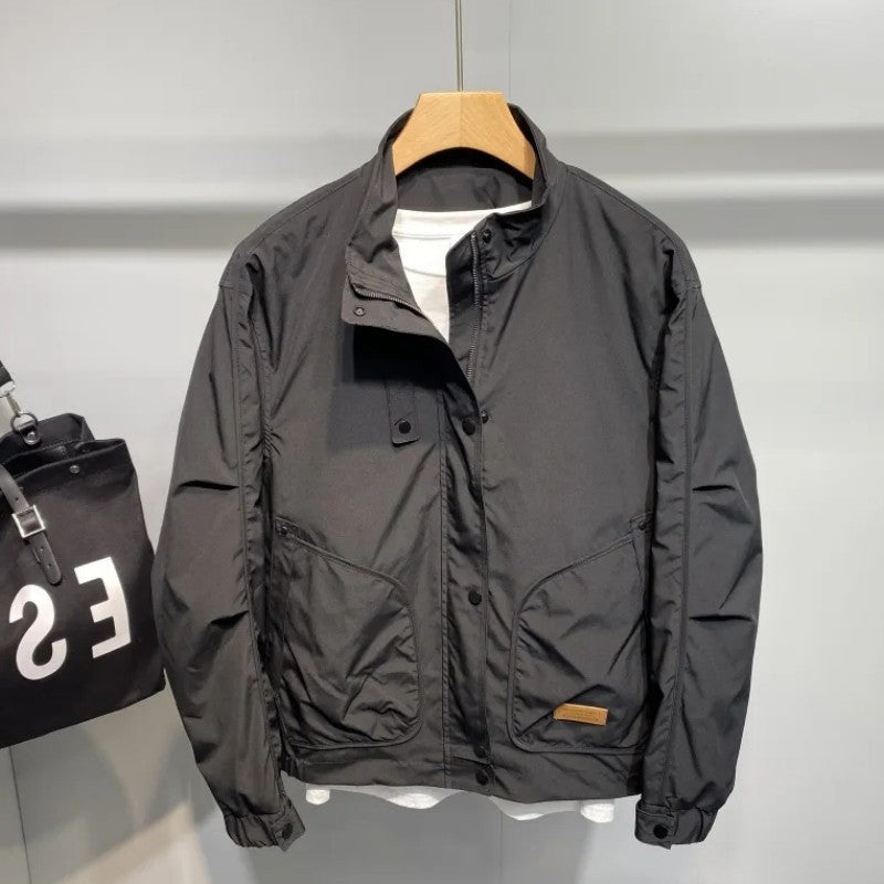 Durable transition jacket for men with practical pocket arrangement and adjustable collar Lune London