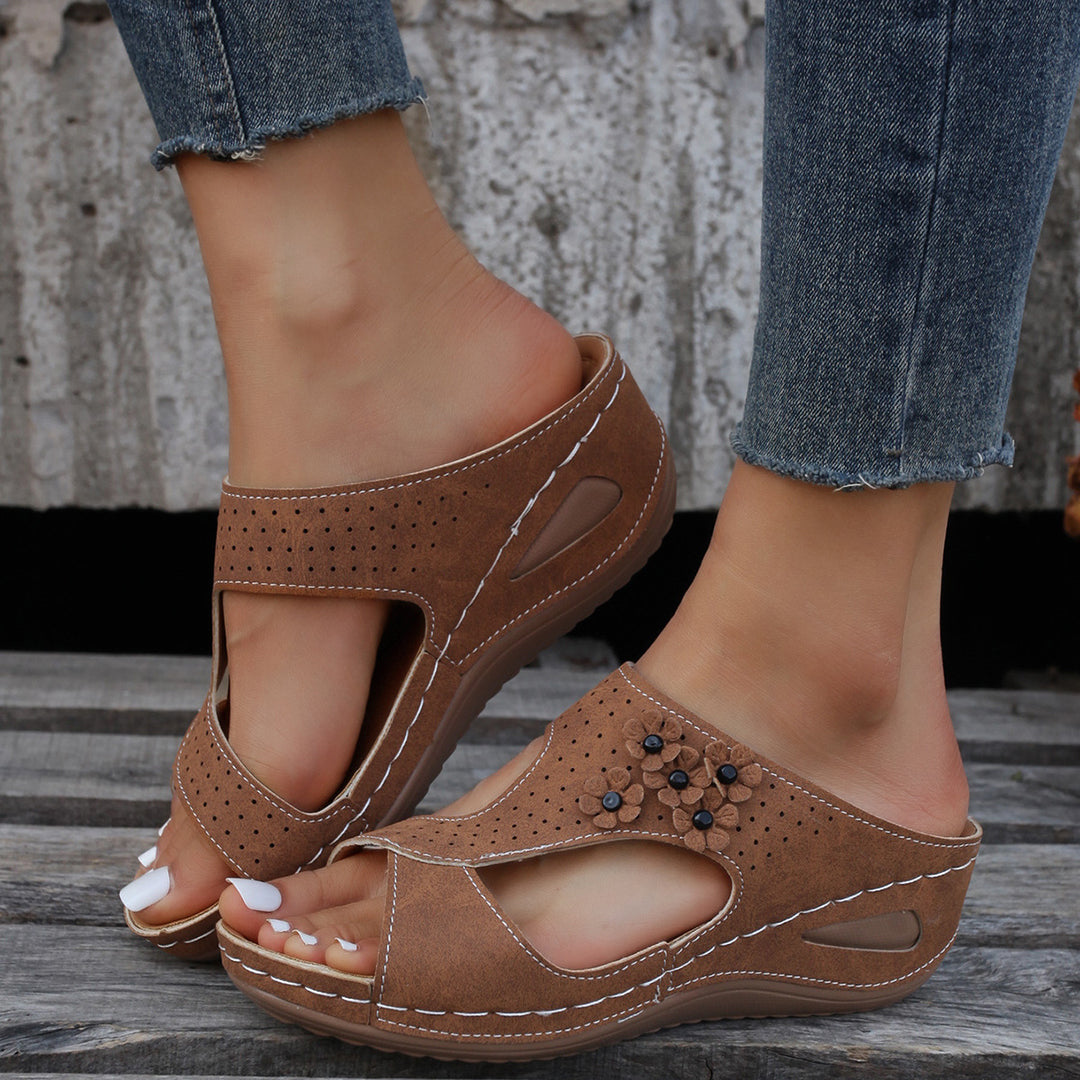 Comfortable wedge sole sandals for women with an airy surface structure and elastic straps Lune London