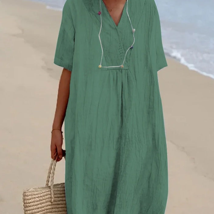 Casual beach dress for women with V-neckline and flowy design Lune London