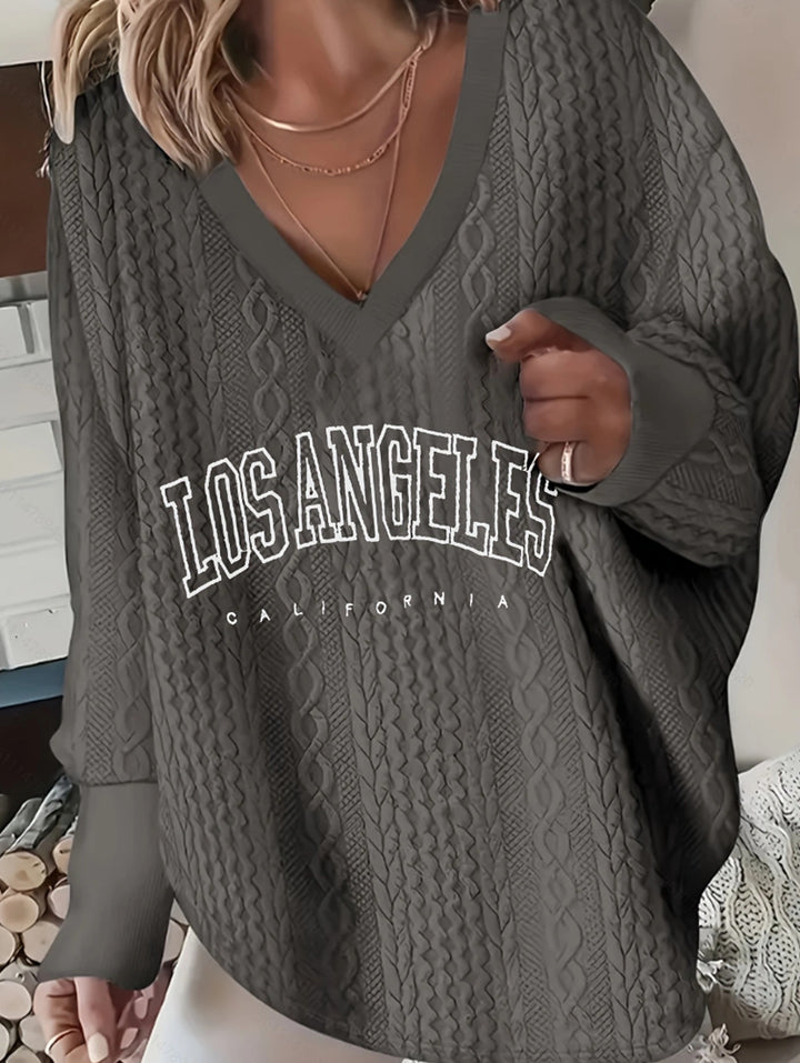 Pull décontracté à col en V pour femmes avec motif en cable Chic & Stil