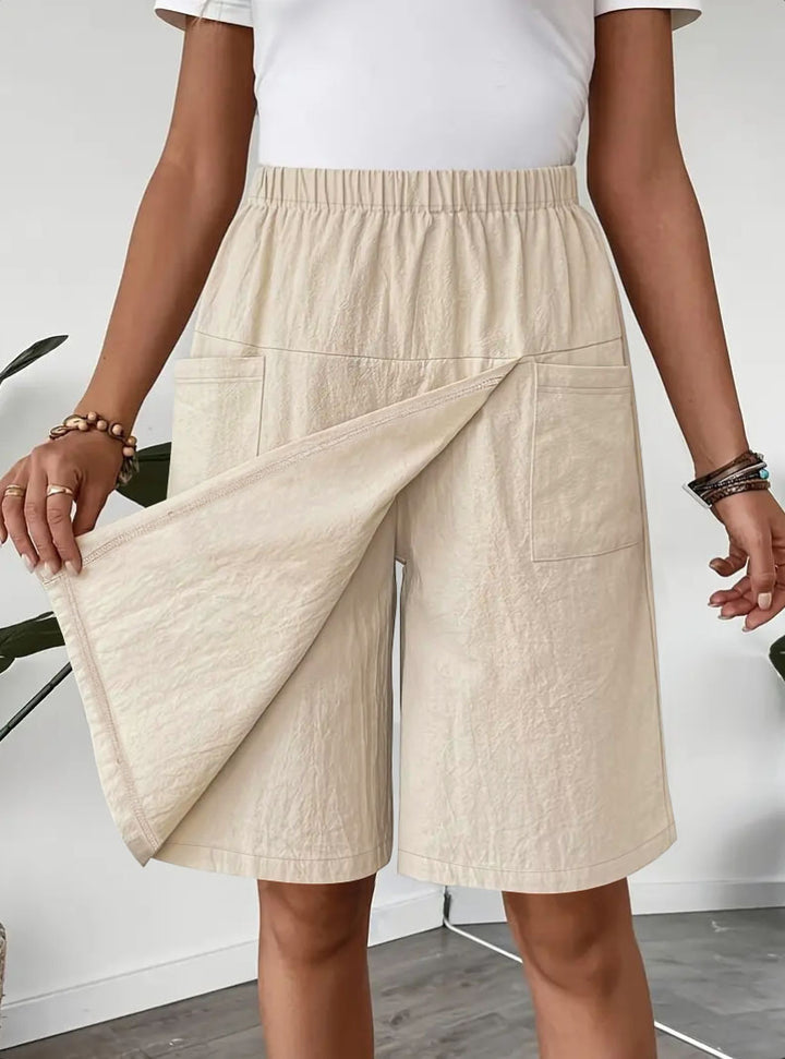 Mid-length wrap skirt for women with elastic waist and practical pockets Chic und Stil