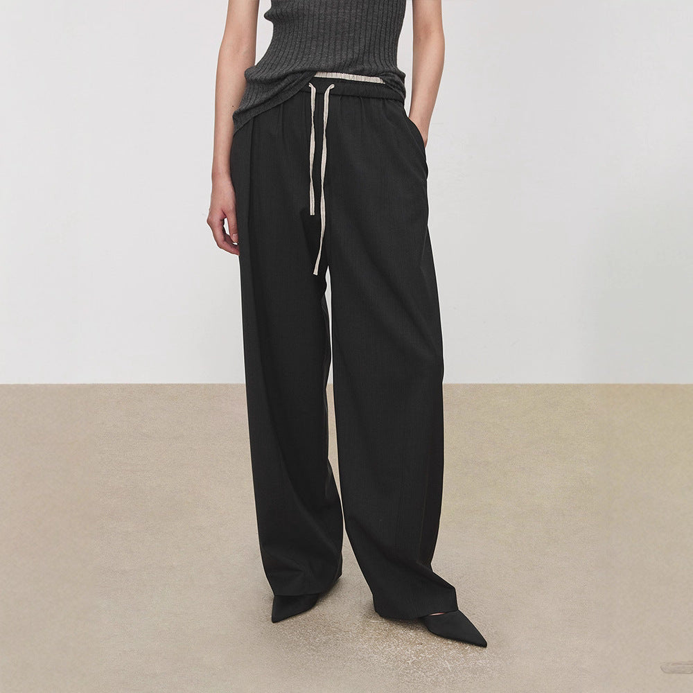 Pantalons en tissu large pour femmes avec taille élastique et poches pratiques Chic & Stil