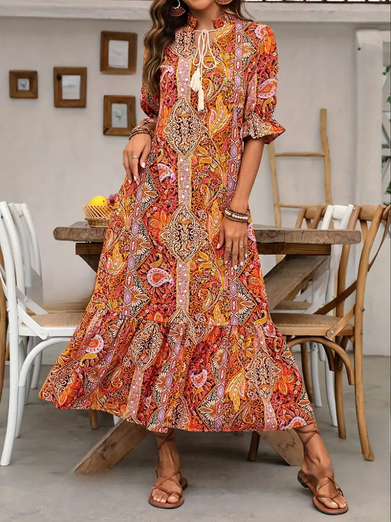 Maxi dress for women with playful paisley pattern and ruffled details Lune London