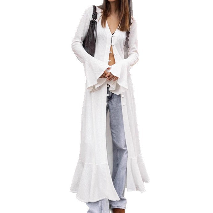 Long knitted coat for women with an elegant cut and a chic button design.
