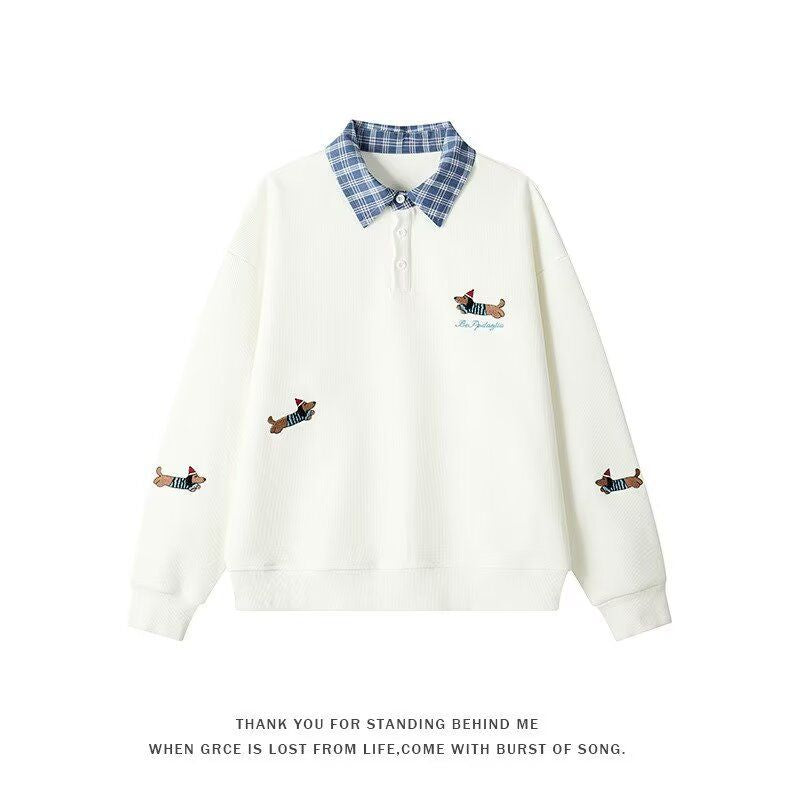 Women's sweater with an elegant checkered pattern and a chic animal print.