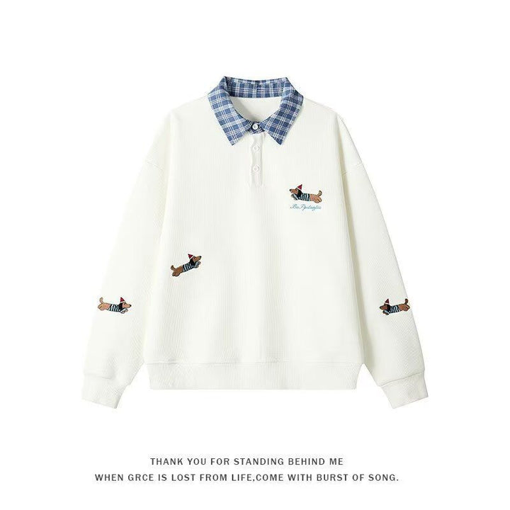 Women's sweater with an elegant checkered pattern and a chic animal print.