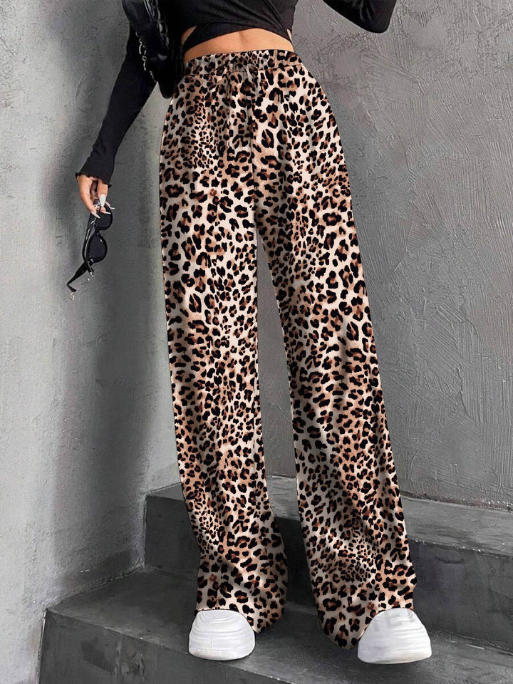 Pantalons plissés à coupe large pour femmes avec taille élastique et poches latérales pratiques Chic & Stil
