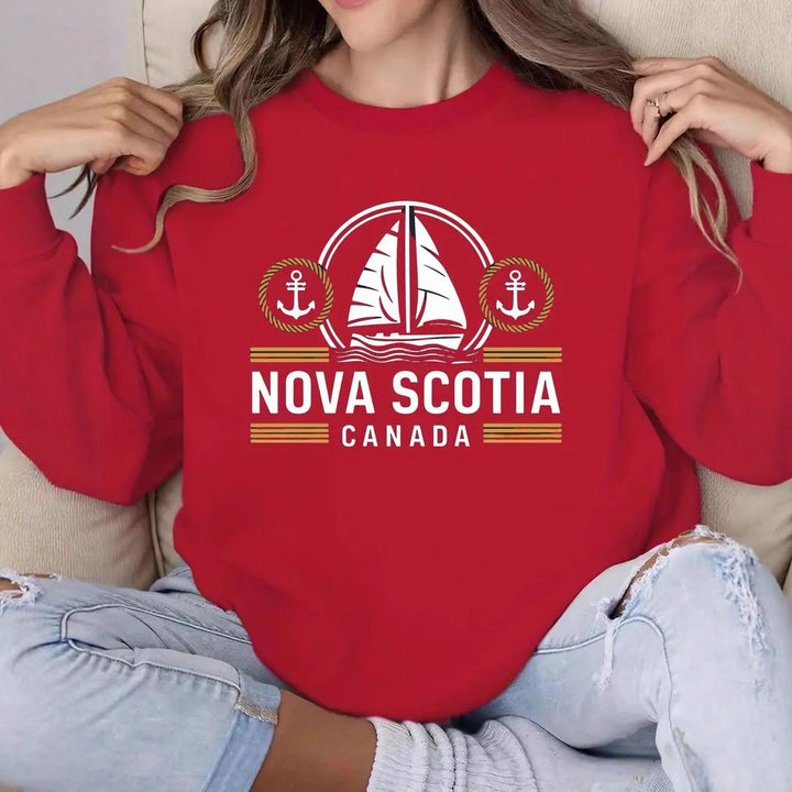 Sweat-shirt pour femmes avec un motif de voile maritime et une lettrage Chic & Stil discret