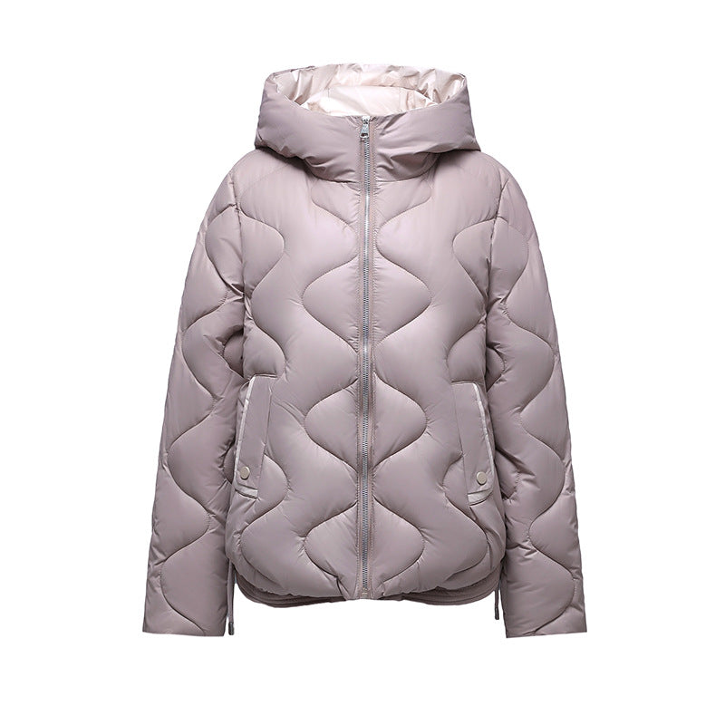Insulated quilted jacket for women with high collar and practical zip pockets Lune London