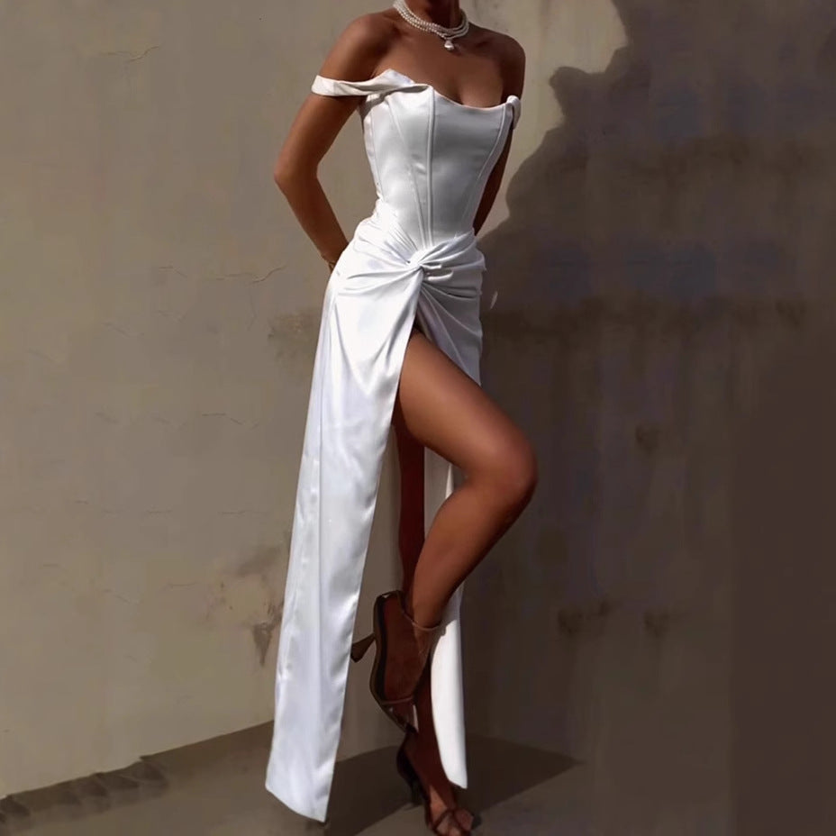 Elegant maxi dress for women with off-shoulder design, side slit, and refined draping Lune London