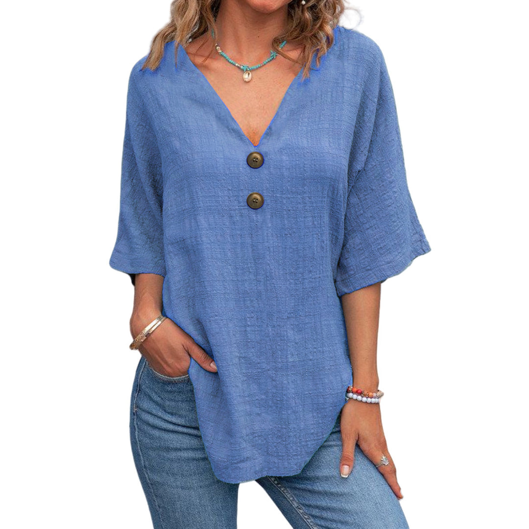 Ladies' V-neck blouse with decorative buttons and chic casual cut