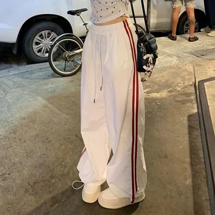 Women's casual sports pants with side stripes and elastic waistband