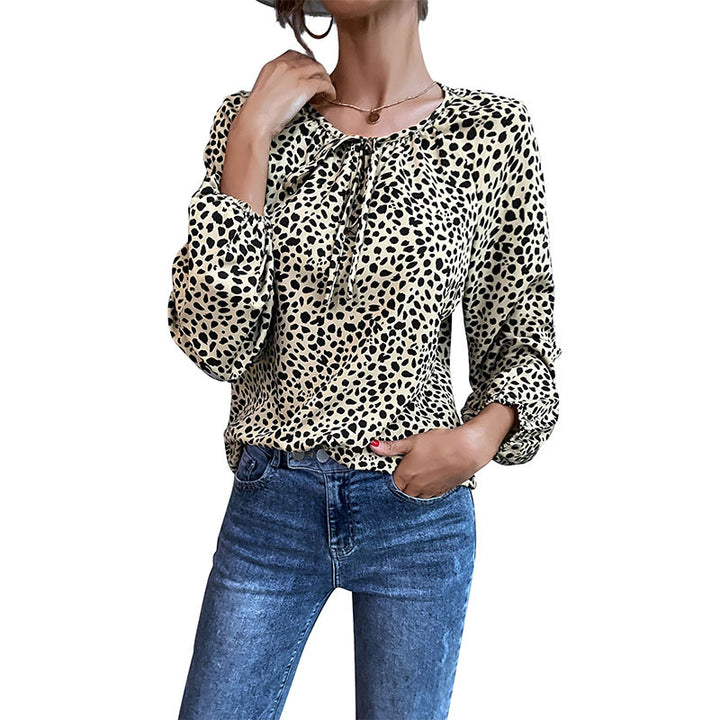 Top femme avec des détails volantés et imprimé animal Chic & Stil