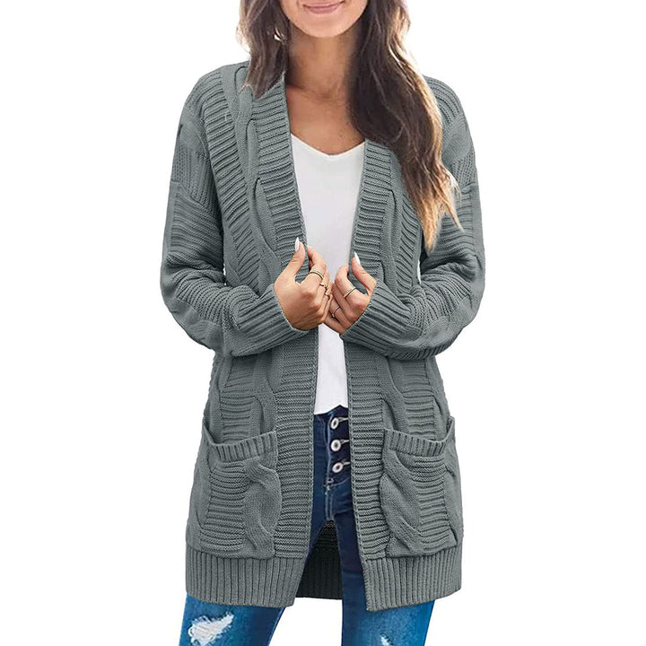 Ladies chunky knit cardigan with elegant cable patterns and practical pockets Lune London