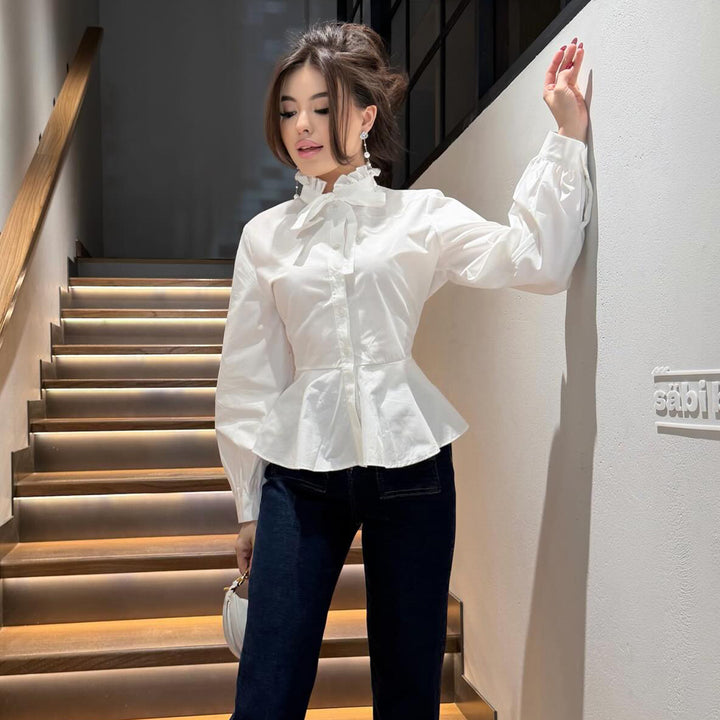 Ladies blouse with ruffle detail and flattering cut