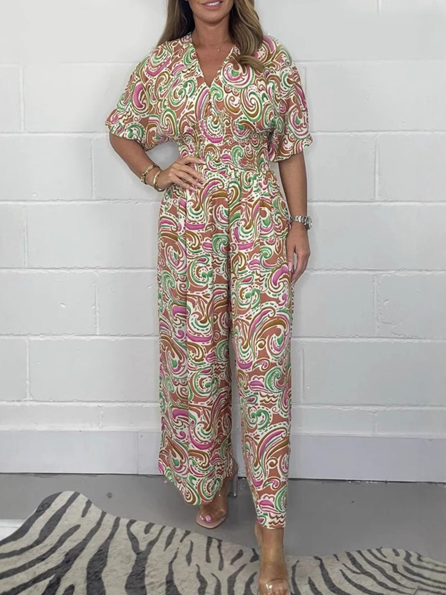 Lady Fluid jumpsuit with elegant paisley pattern and Lune London cinching