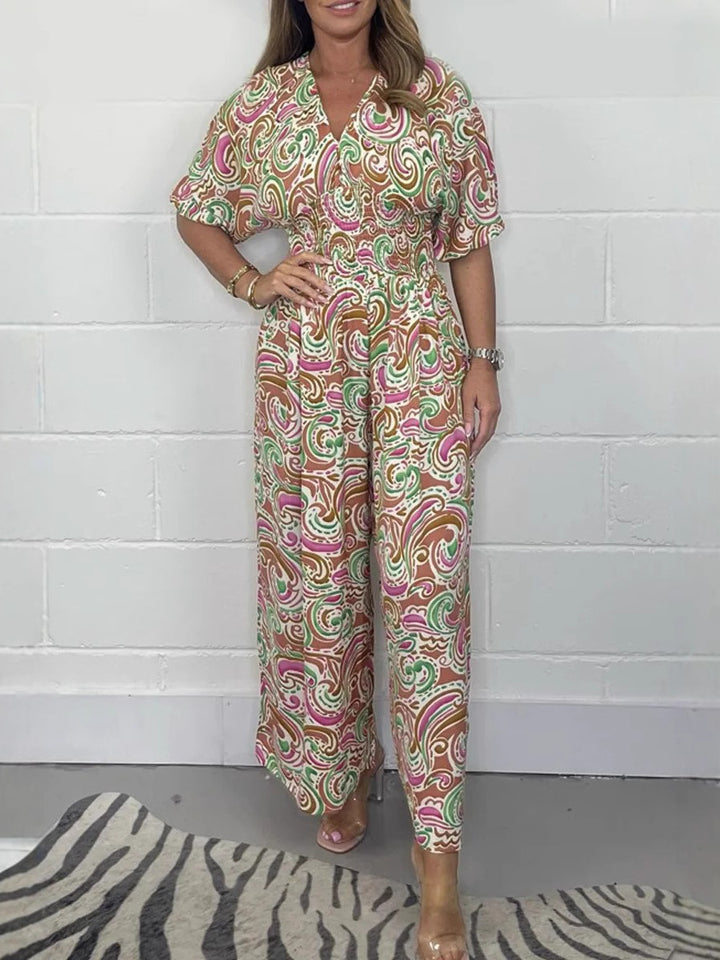Lady Fluid jumpsuit with elegant paisley pattern and Lune London cinching