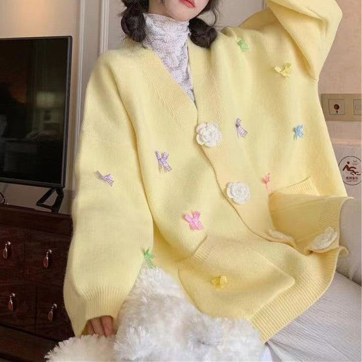 Ladies cardigan with playful flower appliqués and large buttons Lune London