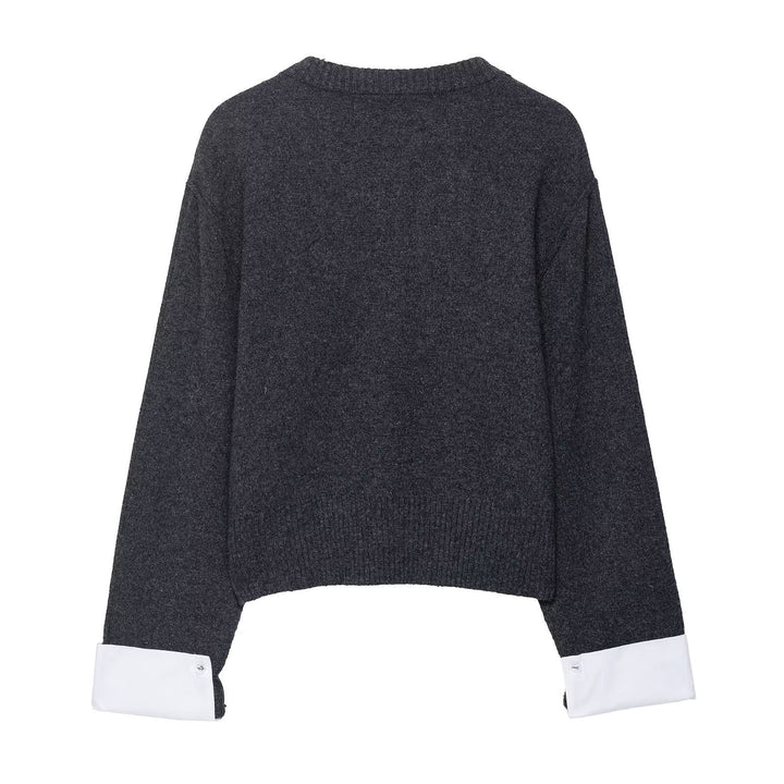 Trendy women's knitted jacket with contrasting sleeves and a continuous button placket Lune London