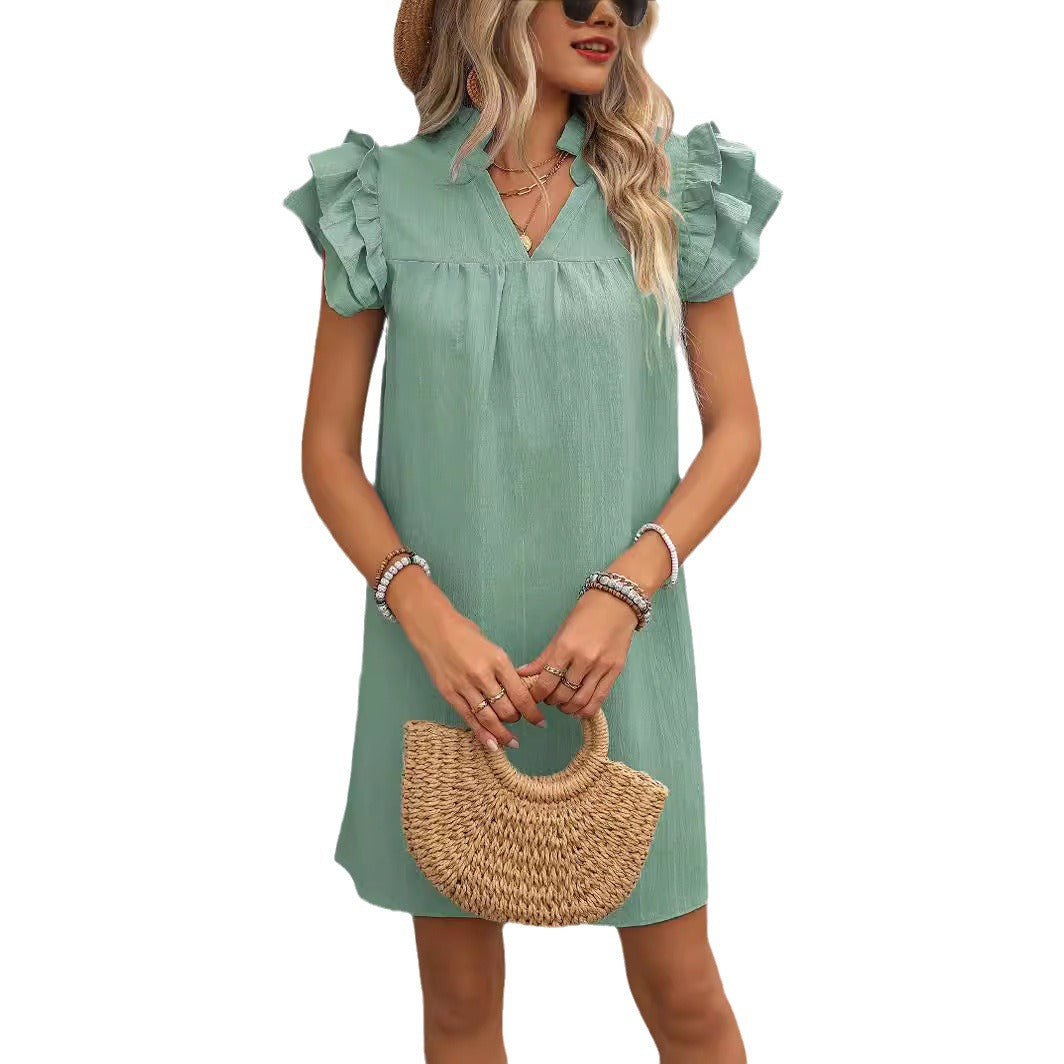 Elegant short-sleeve dress for ladies with ruffle details and V-neck Lune London